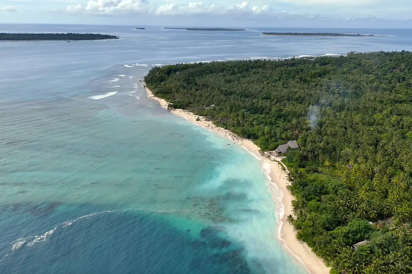 Aerial view of Hidden Bay Resort on its private bay in the Mentawai Islands